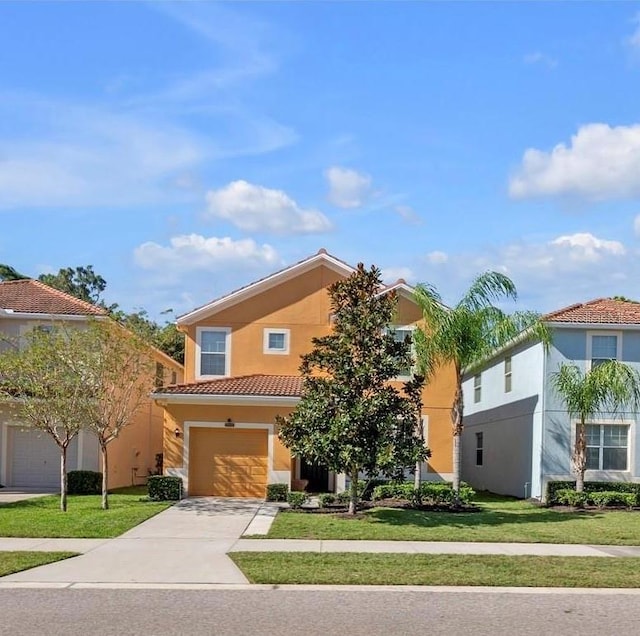 view of front of home featuring a front yard and a garage