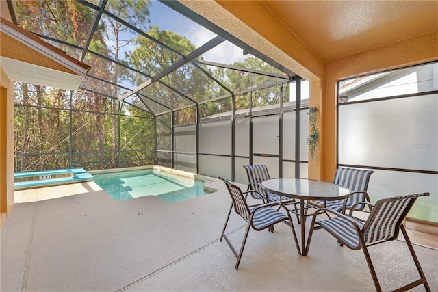 view of swimming pool featuring a lanai, a patio area, and a hot tub