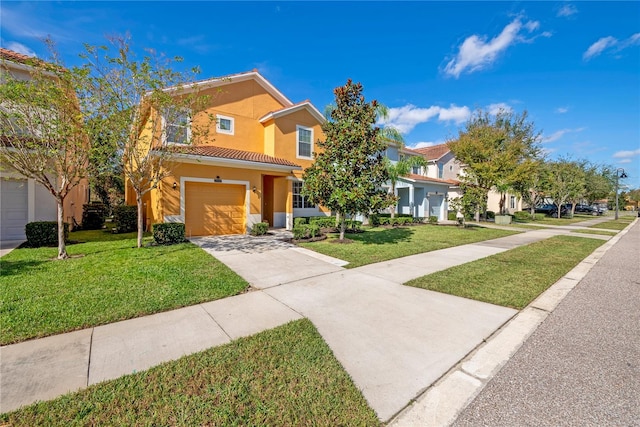 view of front of property featuring a garage and a front lawn