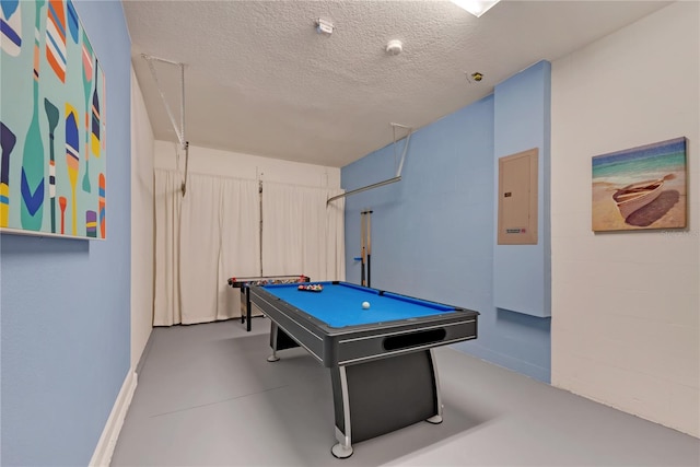 rec room with electric panel, a textured ceiling, and billiards