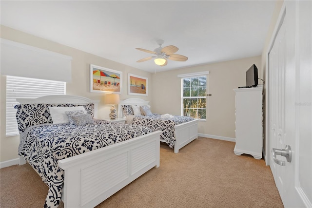 carpeted bedroom featuring ceiling fan