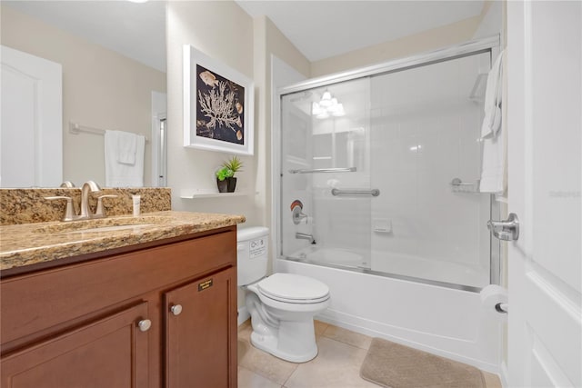 full bathroom featuring tile patterned floors, vanity, enclosed tub / shower combo, and toilet