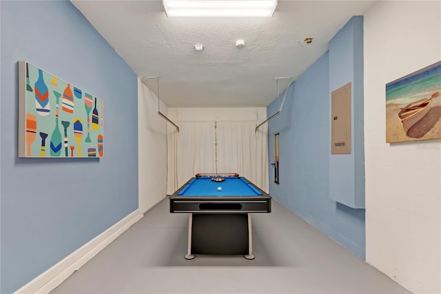 game room featuring a textured ceiling and pool table