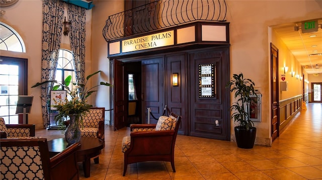 interior space featuring tile patterned flooring and a high ceiling