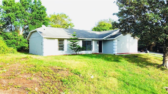 ranch-style house with a front yard