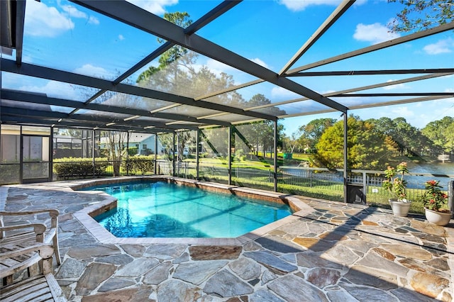 view of swimming pool featuring a lanai and a patio