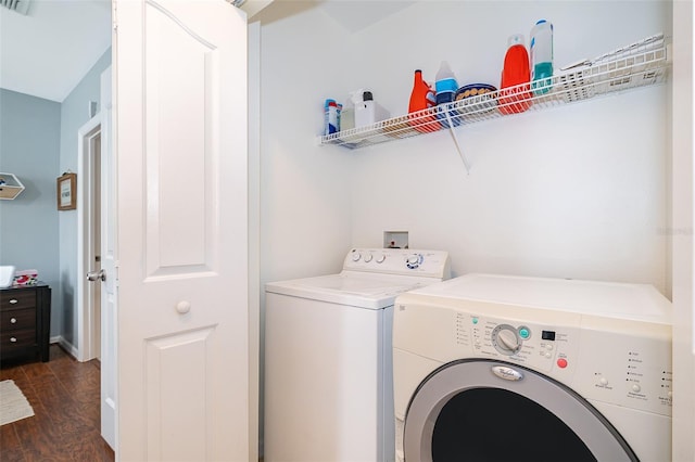 washroom featuring washer and clothes dryer and dark wood-type flooring