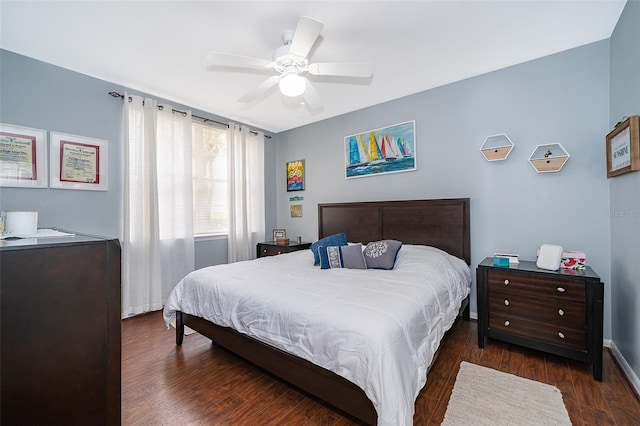 bedroom featuring ceiling fan and dark hardwood / wood-style flooring