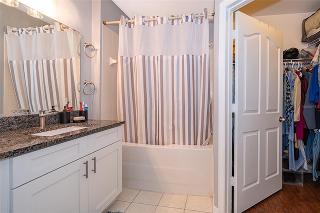 bathroom featuring vanity, wood-type flooring, and shower / tub combo with curtain