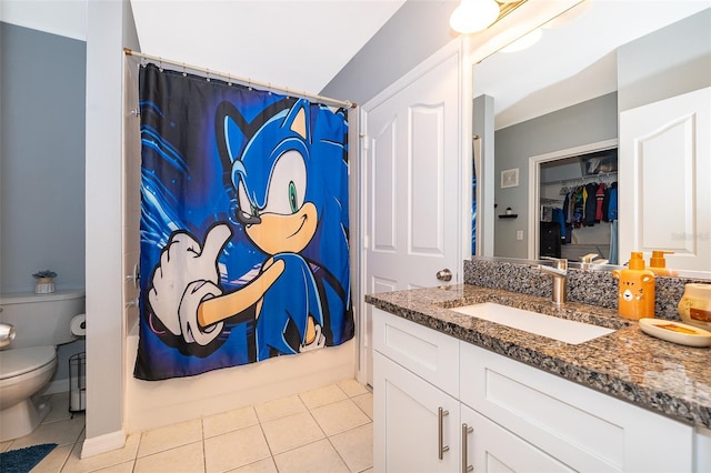 full bathroom with tile patterned flooring, shower / bath combo, toilet, and vanity