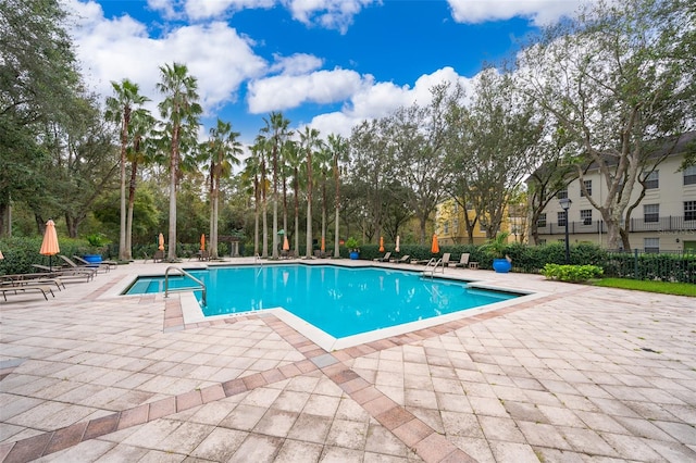 view of swimming pool featuring a patio