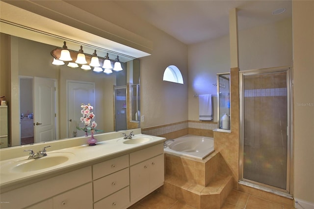 bathroom featuring tile patterned flooring, vanity, and independent shower and bath