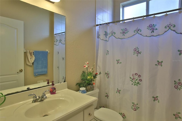 bathroom with vanity and toilet