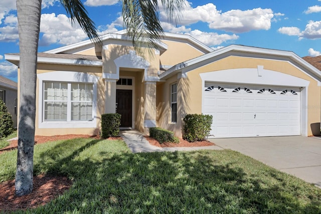 ranch-style home with a front lawn and a garage