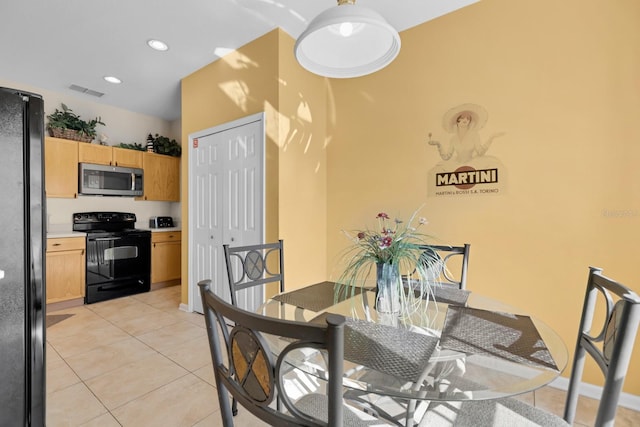 dining space with light tile patterned floors