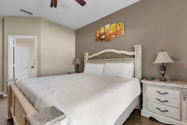 bedroom with ceiling fan and dark wood-type flooring