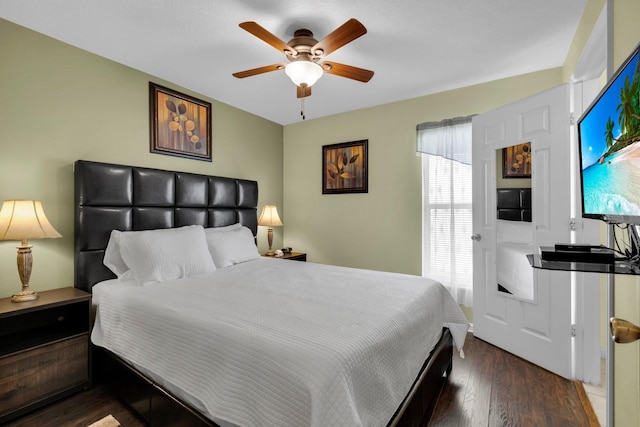 bedroom featuring ceiling fan and dark wood-type flooring