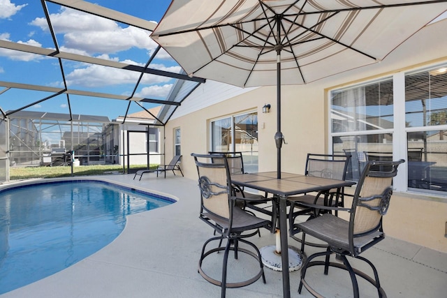 view of pool featuring a lanai and a patio