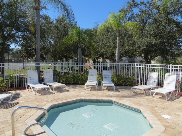 view of swimming pool featuring a patio area