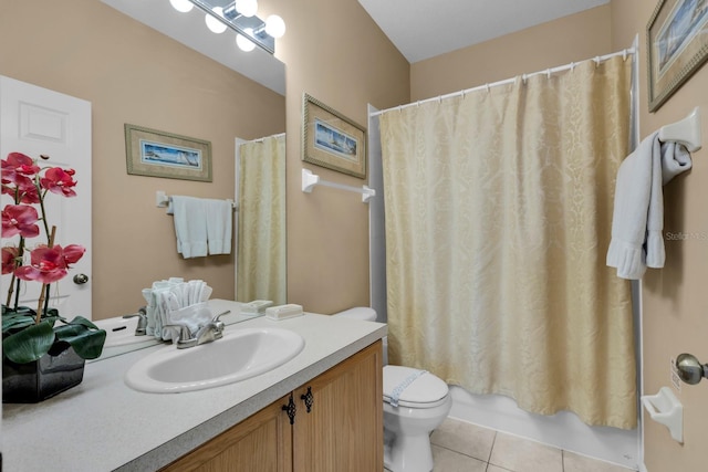 full bathroom with tile patterned floors, shower / tub combo with curtain, vanity, and toilet