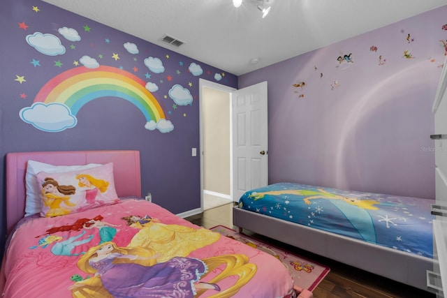 bedroom featuring hardwood / wood-style flooring