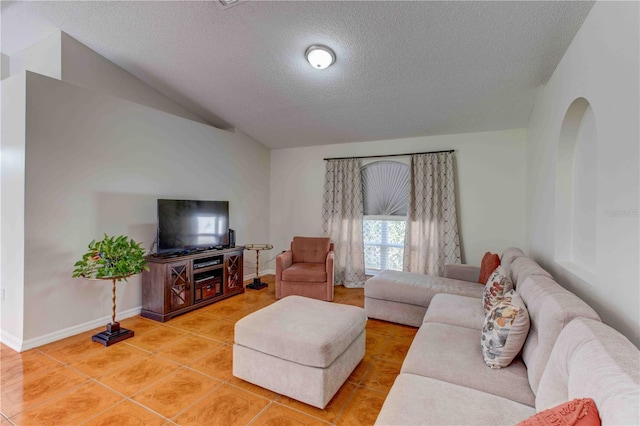 living room with tile patterned flooring, lofted ceiling, and a textured ceiling