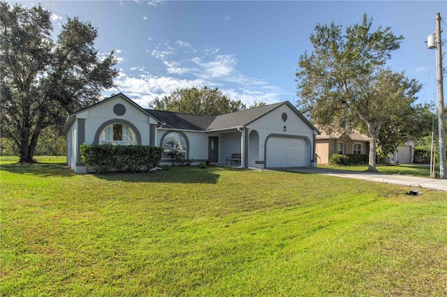 ranch-style house with a garage and a front lawn