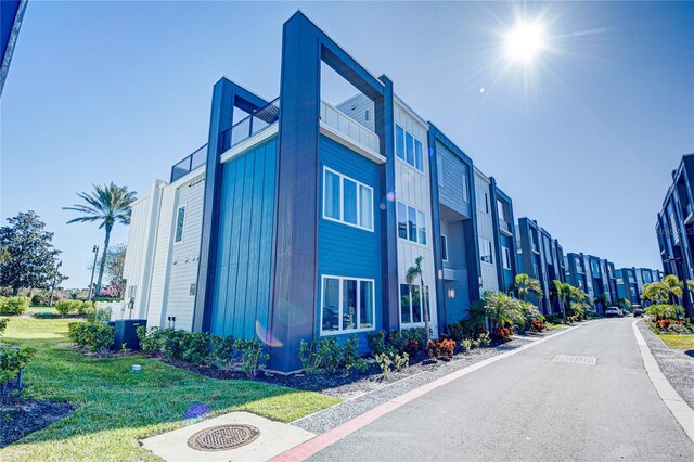 view of building exterior featuring central AC unit