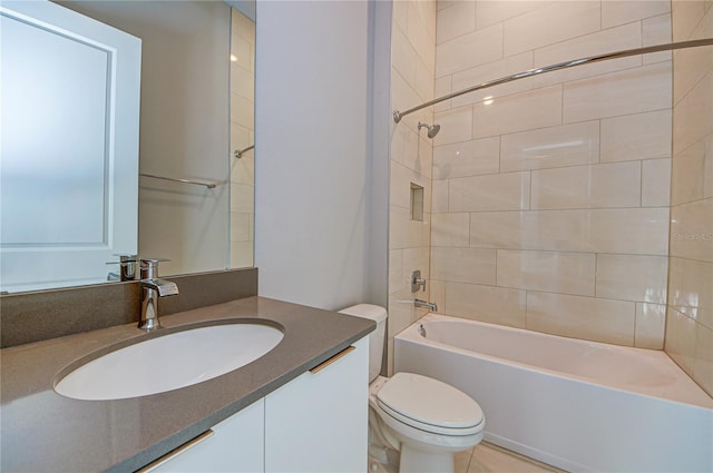 full bathroom featuring toilet, vanity, and tiled shower / bath combo