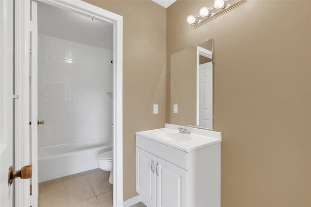 full bathroom featuring tile patterned flooring, vanity, toilet, and tiled shower / bath