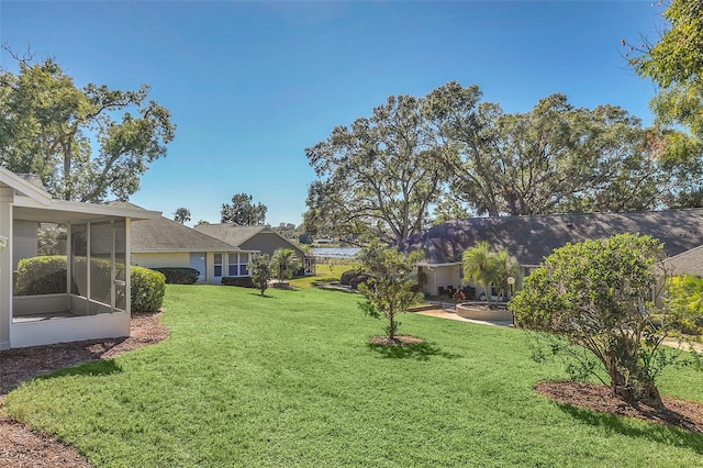 view of yard with a sunroom