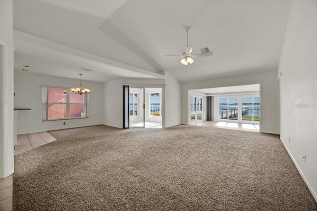 unfurnished living room featuring ceiling fan with notable chandelier and carpet floors