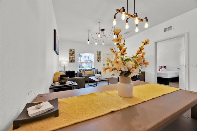 dining space with a notable chandelier