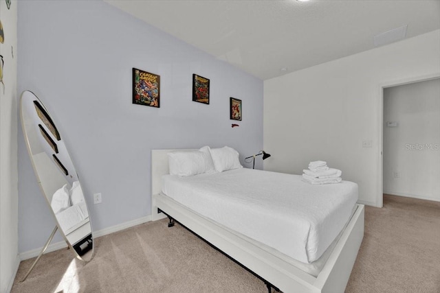 bedroom with light colored carpet