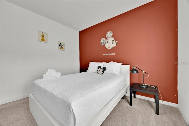 bedroom featuring light colored carpet