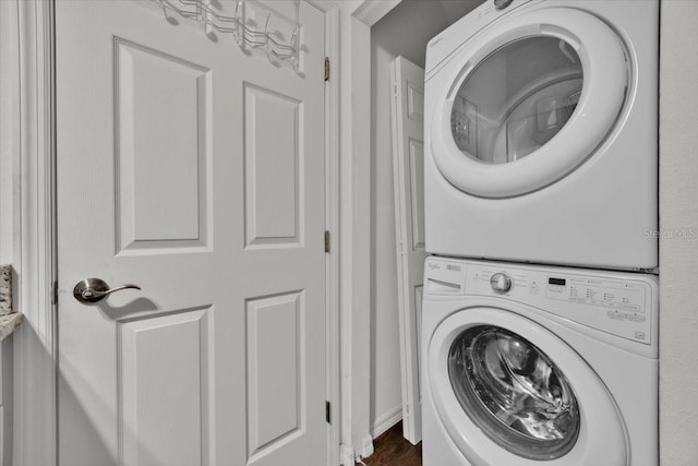 laundry room featuring stacked washer / dryer