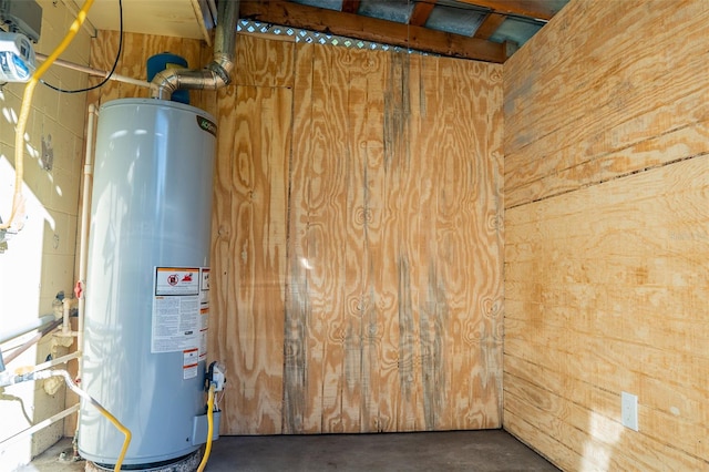 utility room with gas water heater