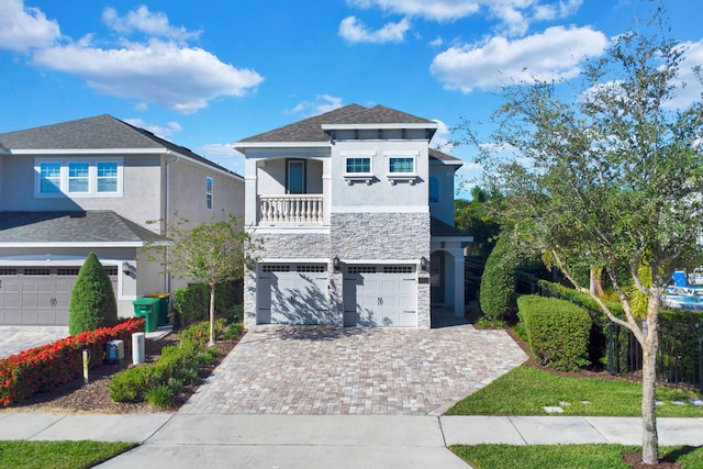 view of front of house with a balcony and a garage