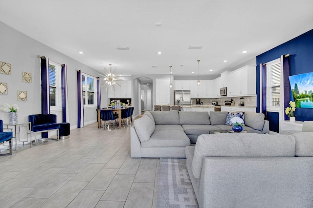 living room featuring an inviting chandelier