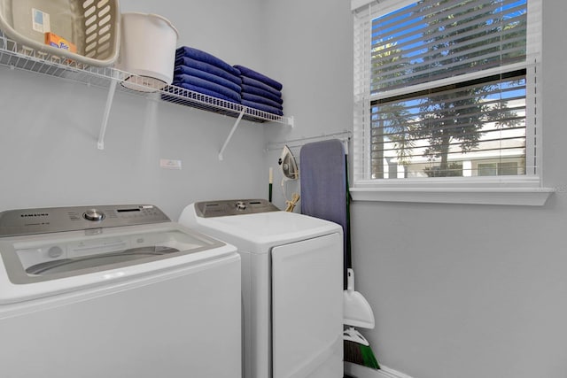 laundry room with washing machine and clothes dryer