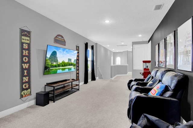 living room featuring light colored carpet and a textured ceiling