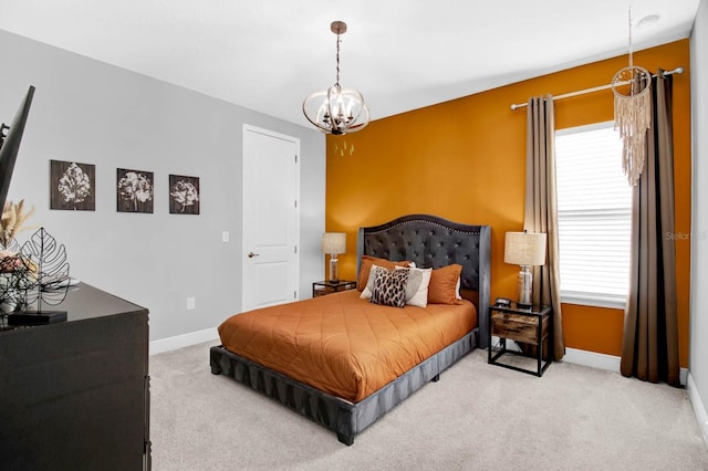 carpeted bedroom with an inviting chandelier