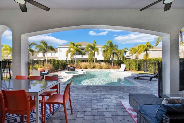 view of swimming pool with a patio area, an in ground hot tub, and ceiling fan