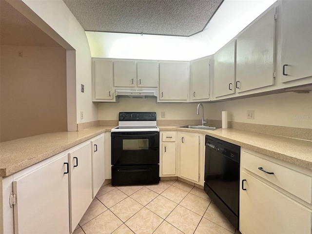 kitchen featuring sink, kitchen peninsula, a textured ceiling, light tile patterned flooring, and black appliances