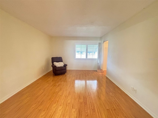 spare room with light hardwood / wood-style floors