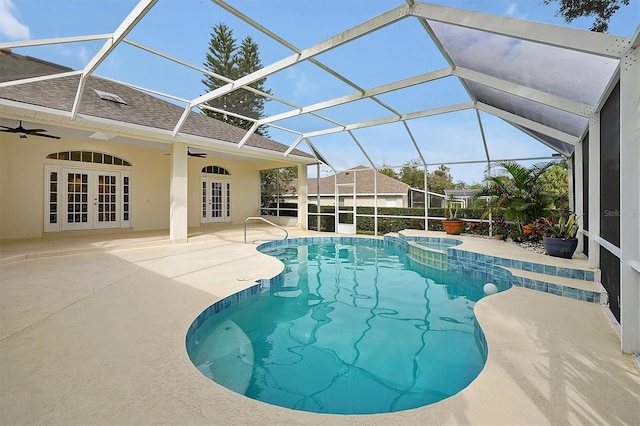 view of swimming pool with french doors, a lanai, an in ground hot tub, ceiling fan, and a patio