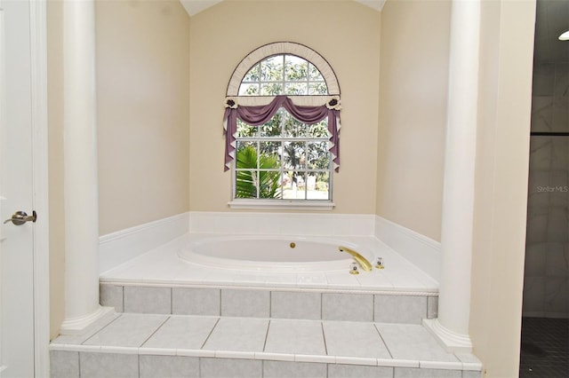 bathroom with tiled tub