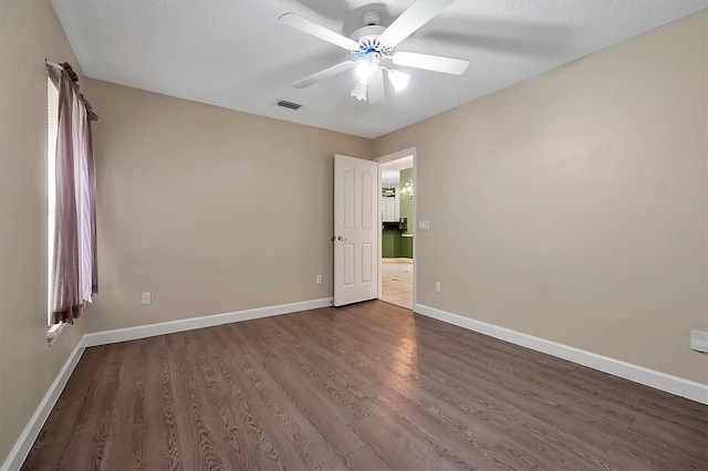 349 Plantation Club Dr, Debary, FL 32713 - spare room with dark wood finished floors, baseboards, and ceiling fan