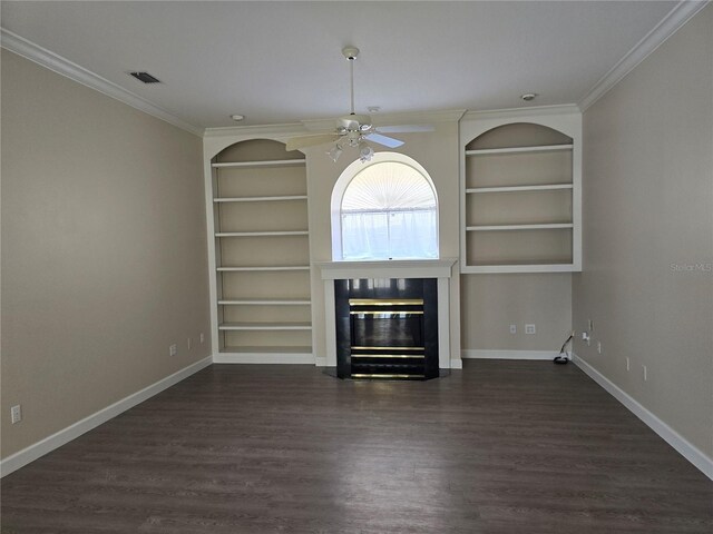 349 Plantation Club Dr, Debary, FL 32713 - unfurnished living room with built in shelves, a ceiling fan, a glass covered fireplace, ornamental molding, and dark wood-style floors