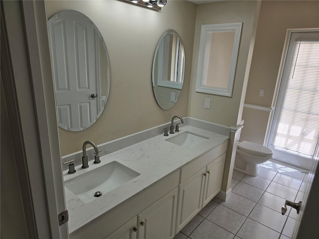 349 Plantation Club Dr, Debary, FL 32713 - bathroom with double vanity, tile patterned floors, and toilet